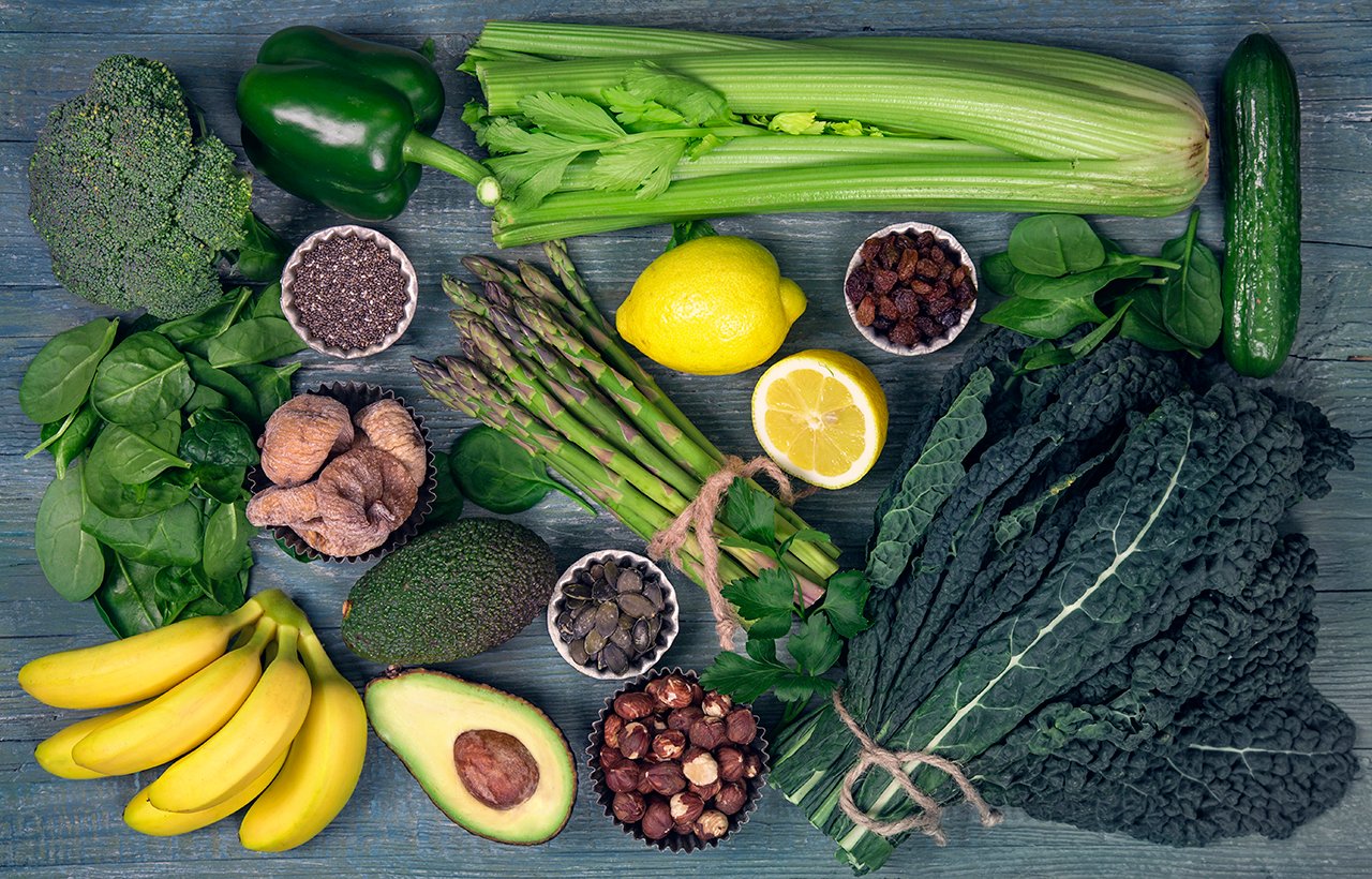 Alkaline foods above the wooden background—debunked: how to become more alkaline and less acidic