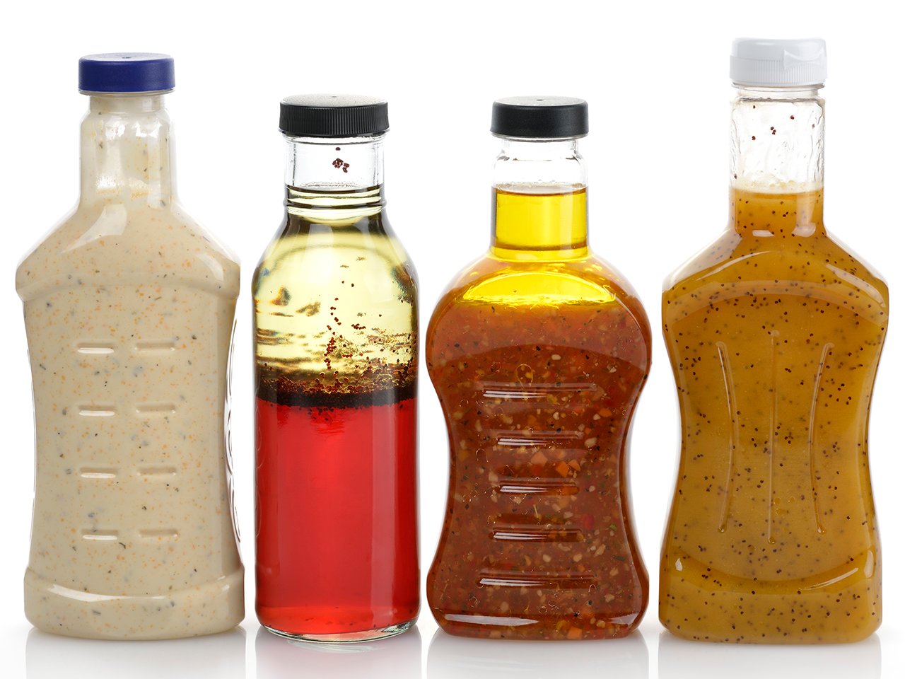 reuse single-use plastics: Assortment Of Four Salad Dressing Bottles without labels