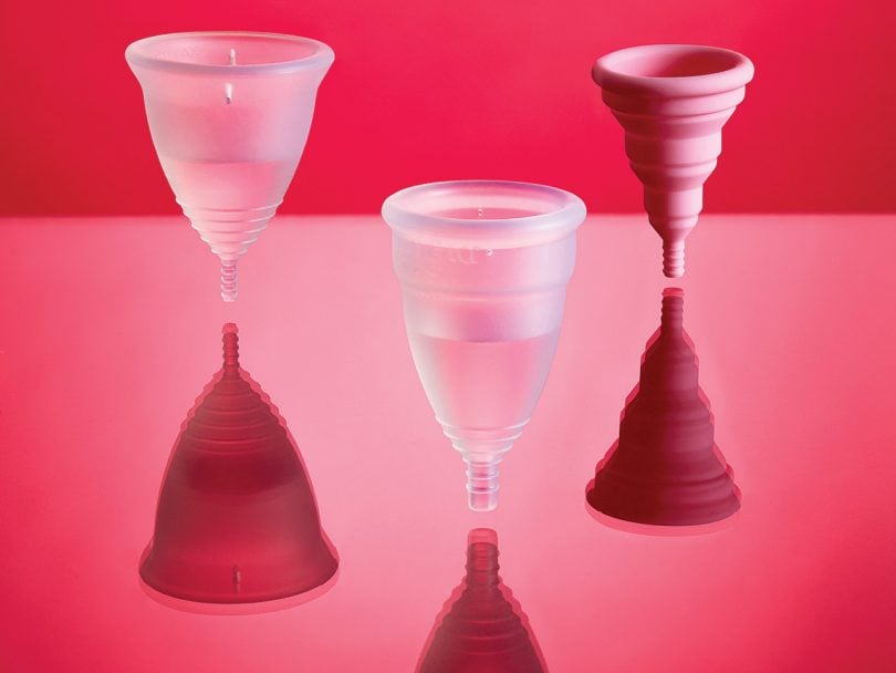 three different silicone cone-shaped cups on a pink background