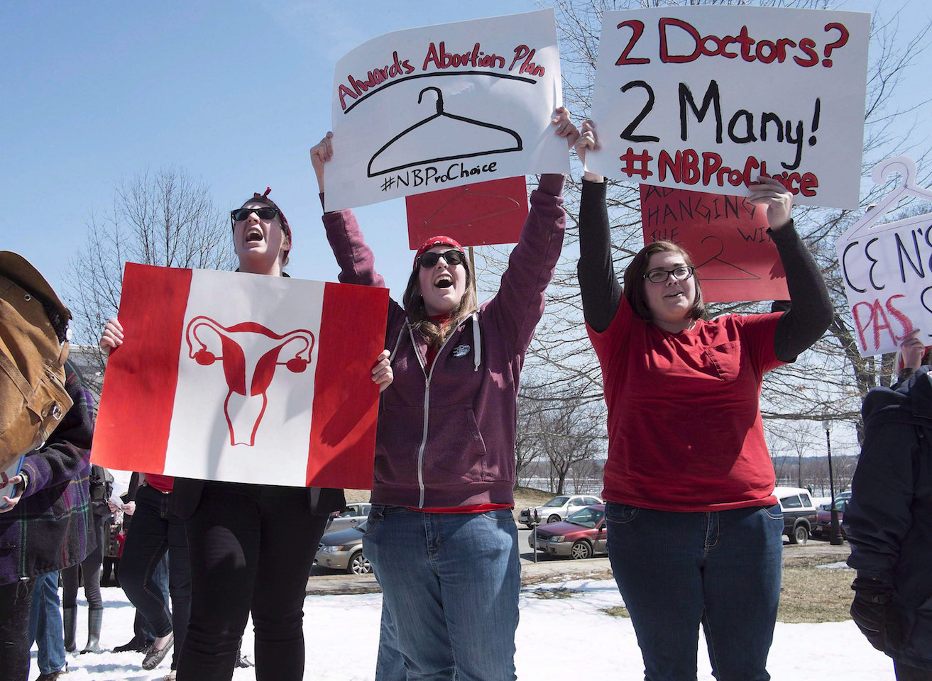 PEI abortion access-women hold signs bearing pro-choice message