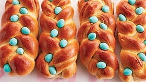 loaves of bread topped with blue mini eggs