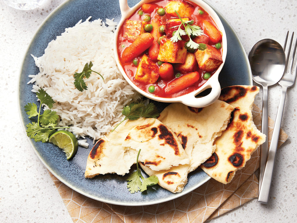 Paneer and carrot curry with rice and naan.