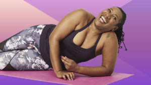 A woman demonstrates an exercise on a mat for a piece on core and glute exercises