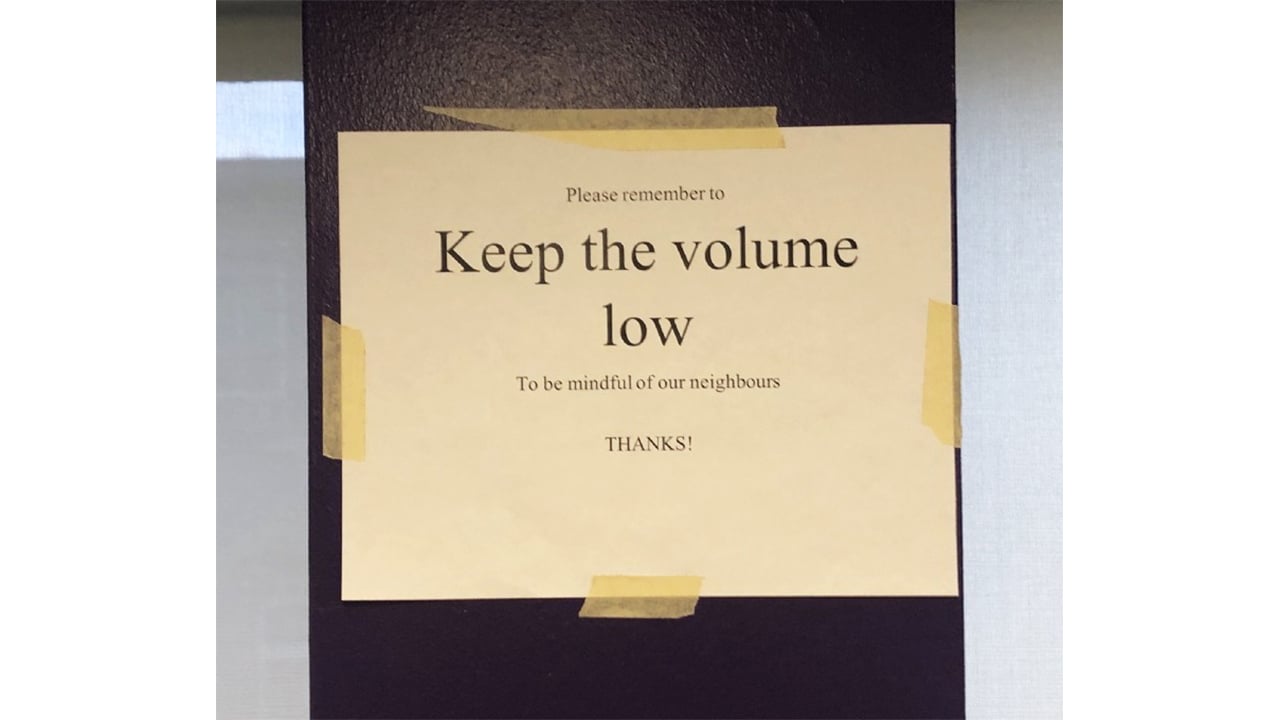 A photo of a sign reading "Keep the volume low."