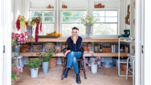 Floral designer Cynthia Zamaria in the potting shed adjacent to her cutting garden.