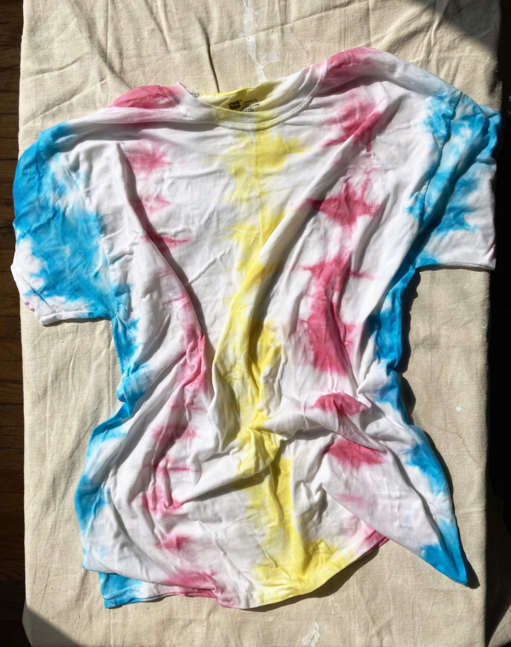 A rinsed tie-dyed t shirt ready to be dried
