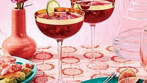 Pomegranate punch in coupe cocktail glasses