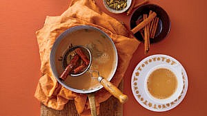 Masala Chai tea in pot with loose spices