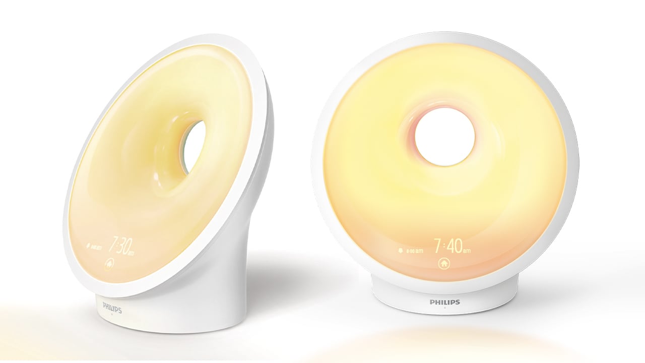 Two images of the wake-up light: one of the light to the side, and the other of the light facing forward.