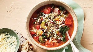 Instant Pot Barley Minestrone Soup in beige bowl with spoon