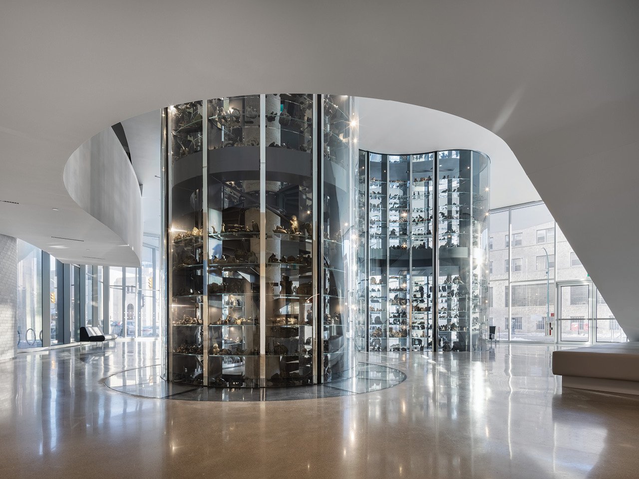A photo of the glass exhibition vault in the entrance way of Qaumajuq. 