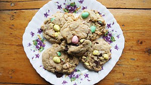 A plate of Cake and Loaf's mini egg chocolate chunk cookies, which are an easy Easter cookie recipe
