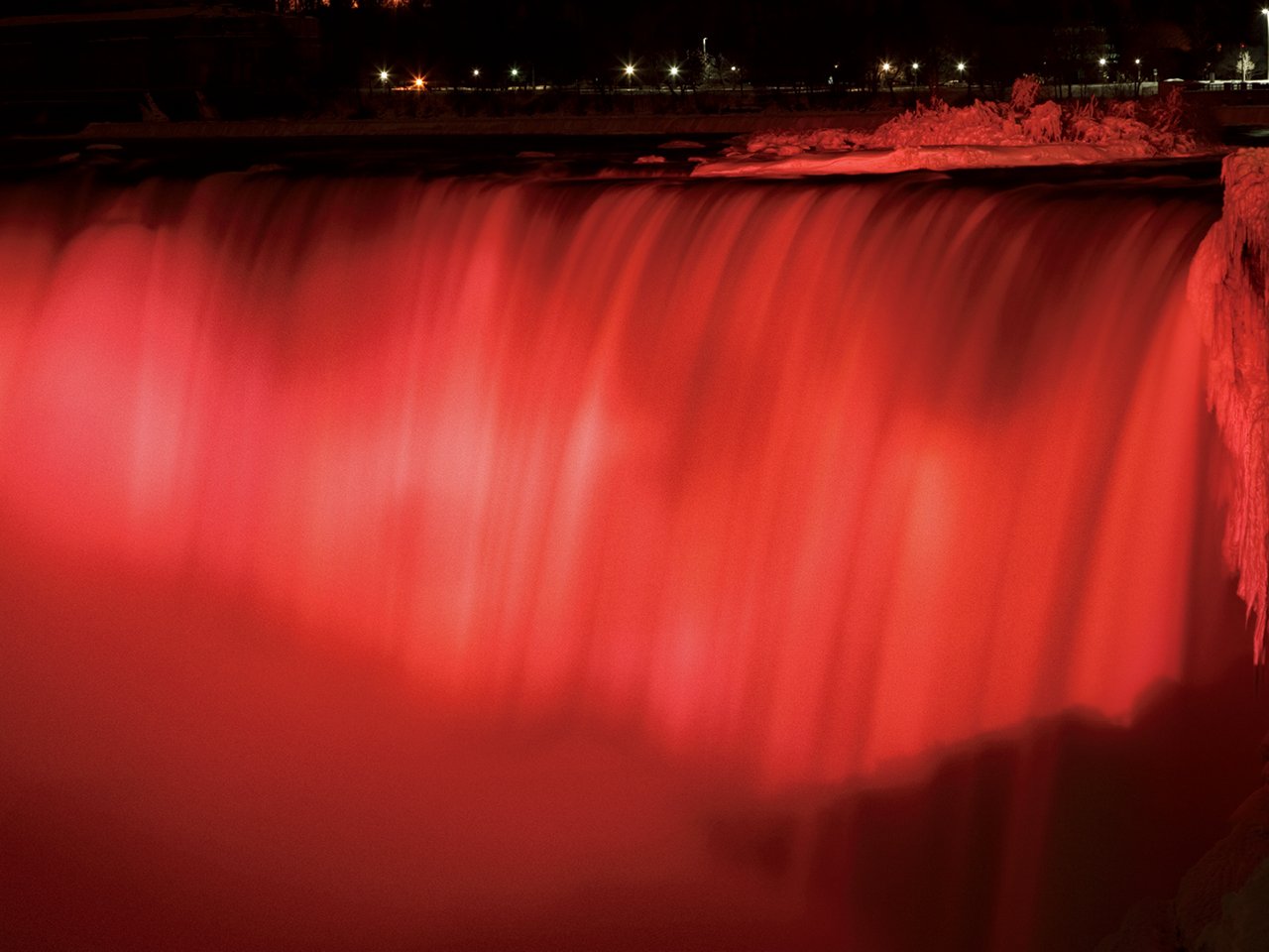 A photo of Niagara Falls with a red filter. 