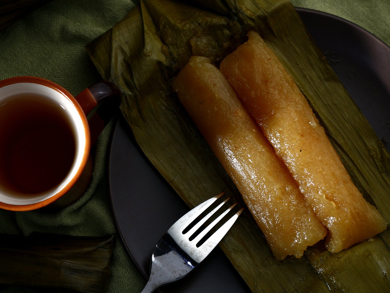 Two pieces of suman on banana leaf