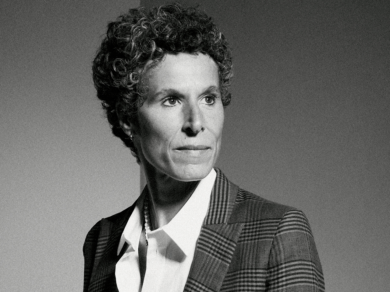 A black-and-white photograph of Andrea Constand