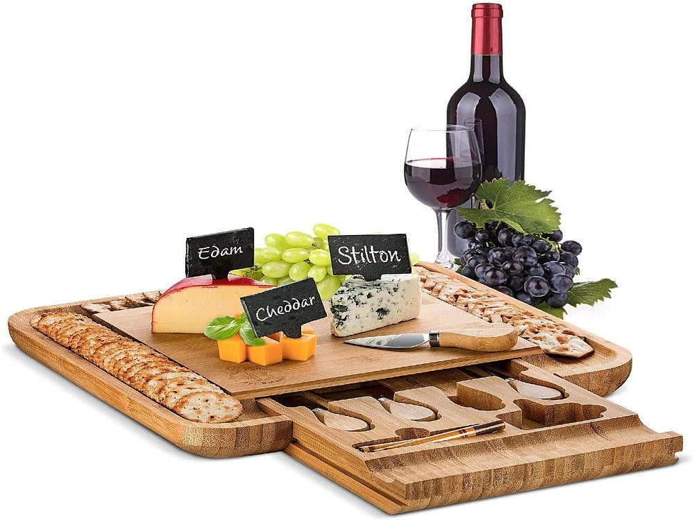 A charcuterie board with a slide out drawer.