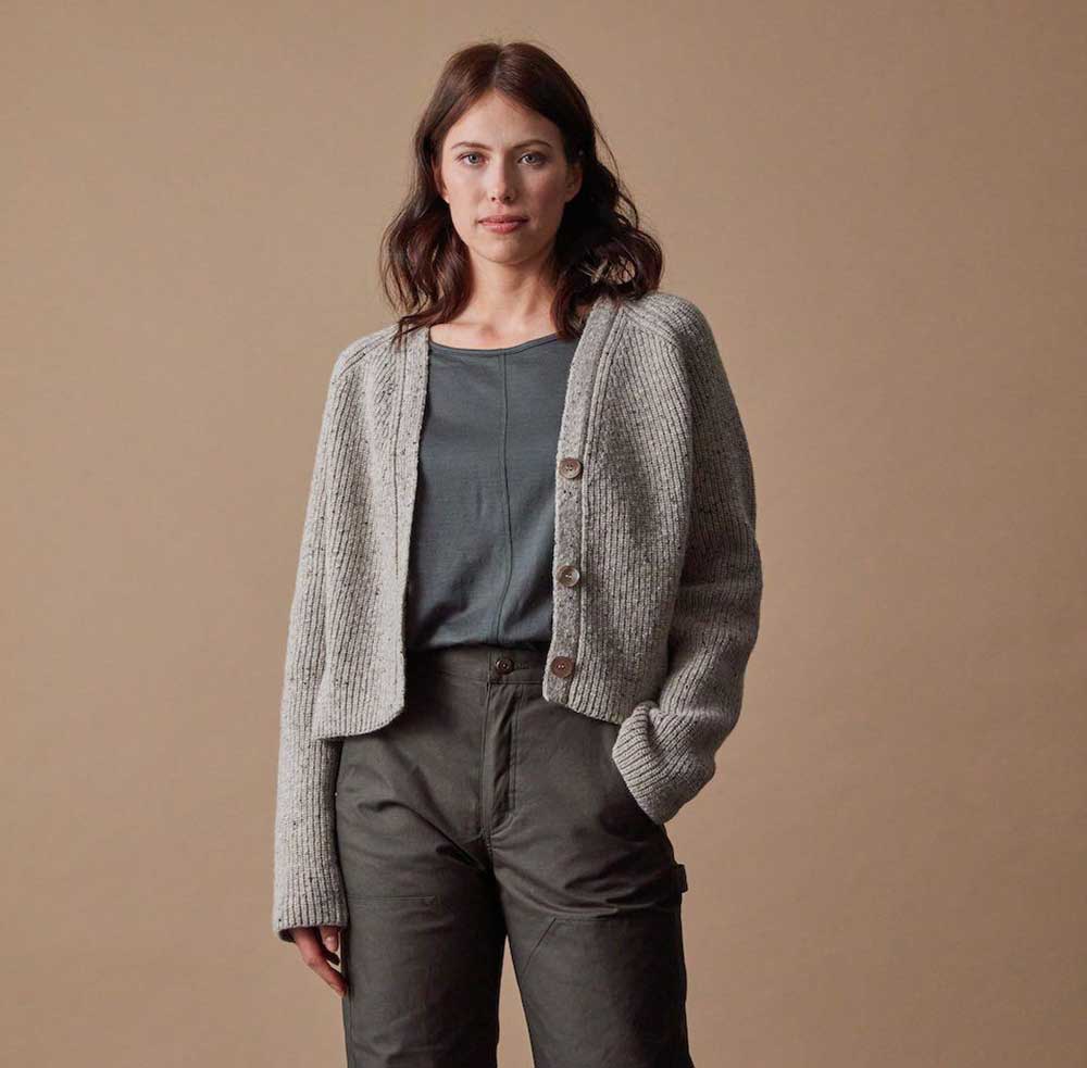 A model wearing a grey merino wool cardigan from Ecologyst.