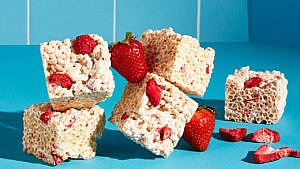 Vegan crispy rice berry squares, rice crispie squares with strawberries embedded in them