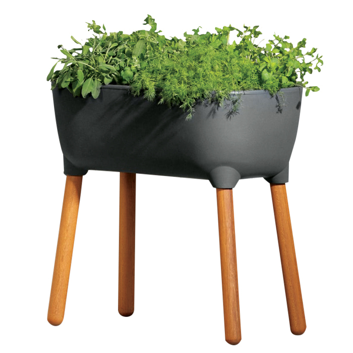 A photo of a black rubber outdoor planter on tall wooden legs
