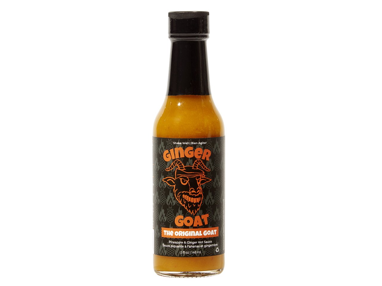 Tall bottle with orange liquid inside and a black label with orange writing reading "Ginger Goat" and an illustration of an angry goat head