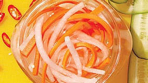 light orange pickled daikon in a glass jar