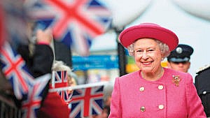 Queen Elizabeth II smiles as she walks during her visit to Newcastle, northern England, November 6, 2009. (Photo: Britain Royals Society)