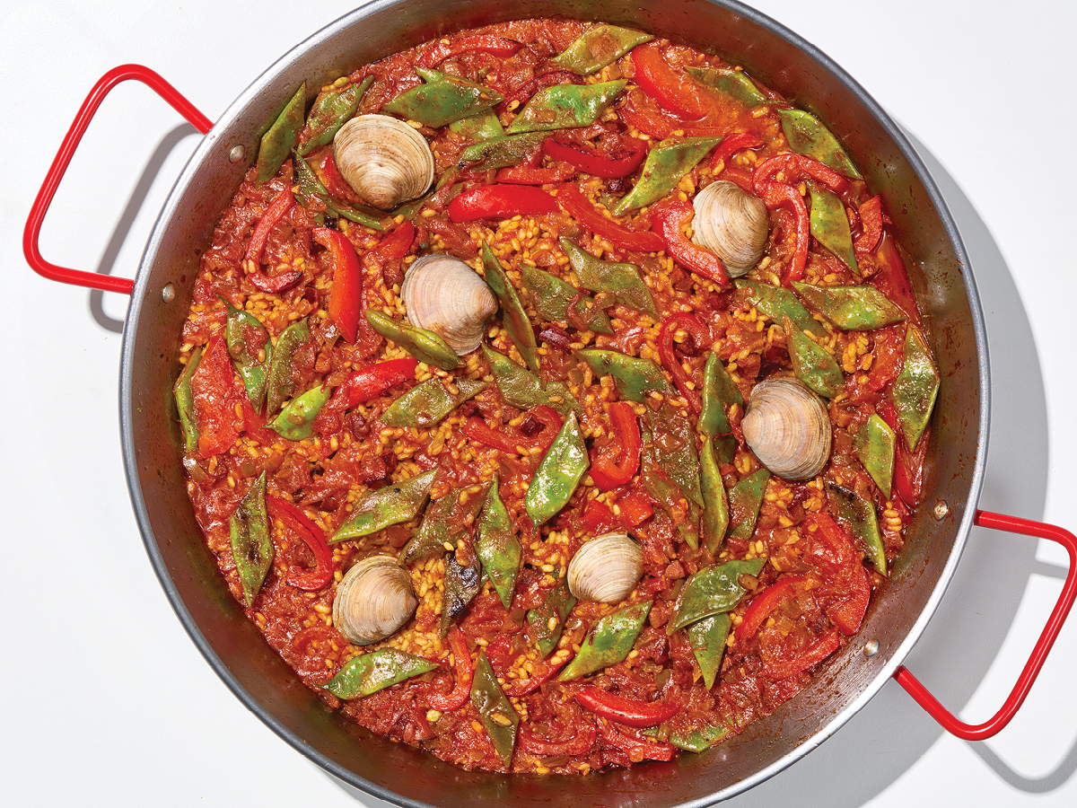 Seafood paella cooking in a pan