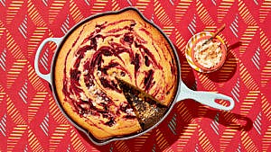 Skillet cornbread with a roasted beet swirl served alongside a toasted coconut rhum butter