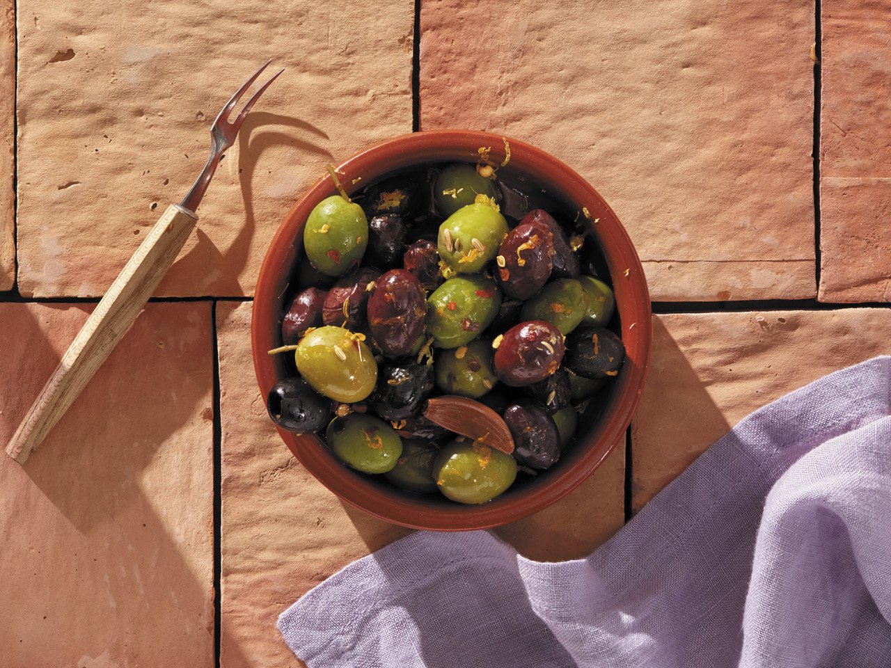 a bowl of marinated olives