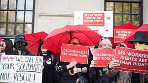 Sex workers and their supporters gather outside the Ontario Superior Court during the launch of their constitutional challenge to Canada's sex work laws, on Monday, October 3, 2022.