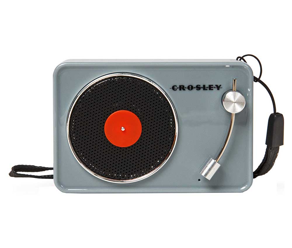 A mini grey Crosley bluetooth speaker shaped like a tiny turntable.