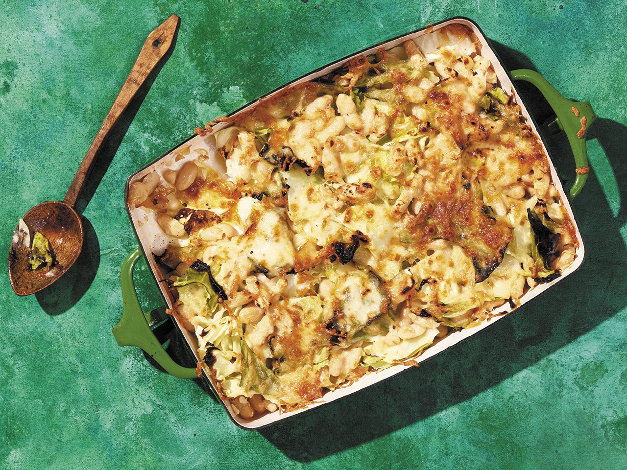 Cheesy cabbage and white bean casserole made with leftover grilled cabbage