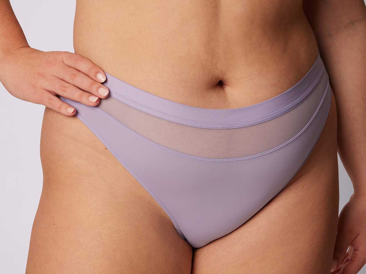 A pair of purple underwear from Parade with a mesh panel at the front, seen on model.