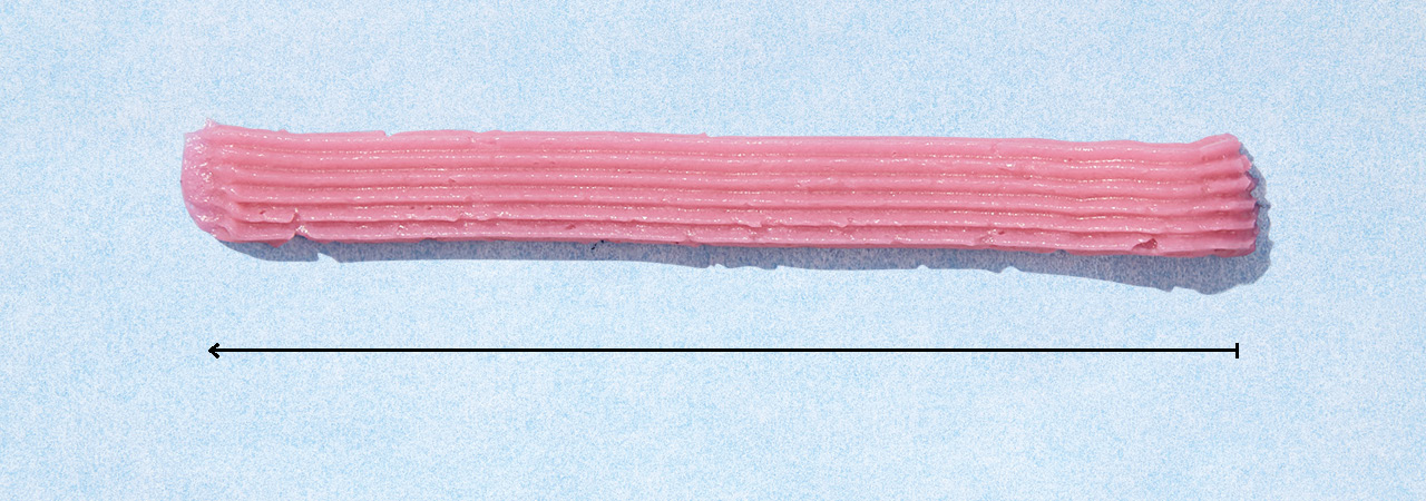 A border design of icing using a basket-weave tip