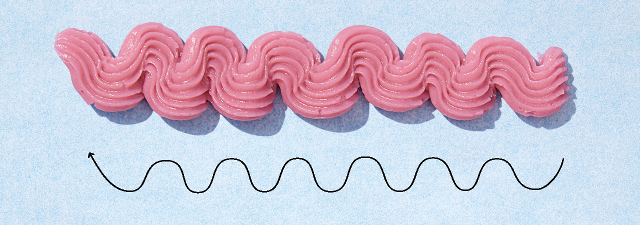 A squiggle design of icing using a basket-weave tip