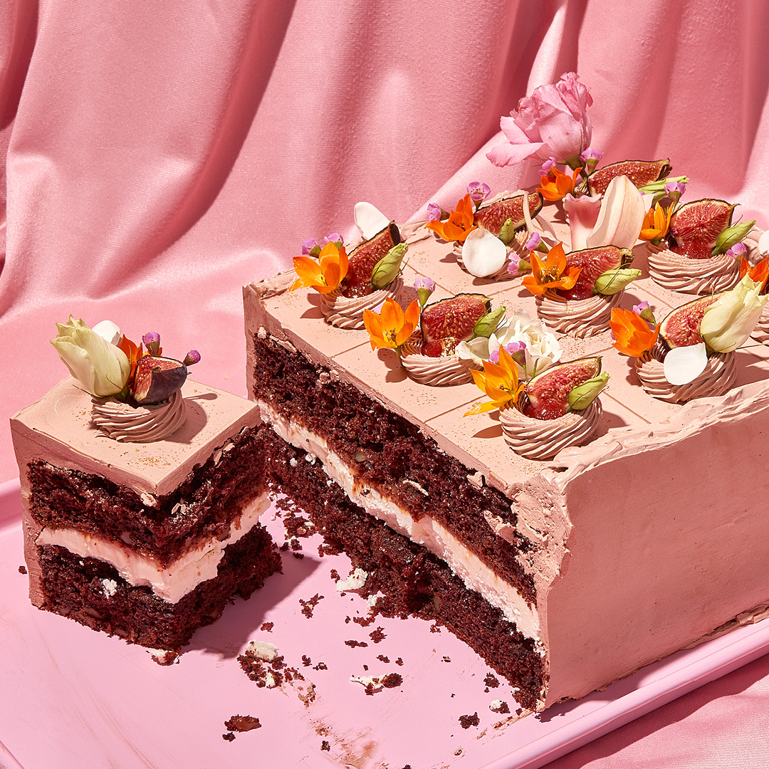 A sheet cake with chocolate frosting and elaborate garnishes.