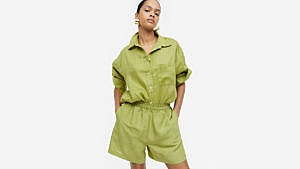 A model wearing green linen-blend shorts with a matching top from H&M.