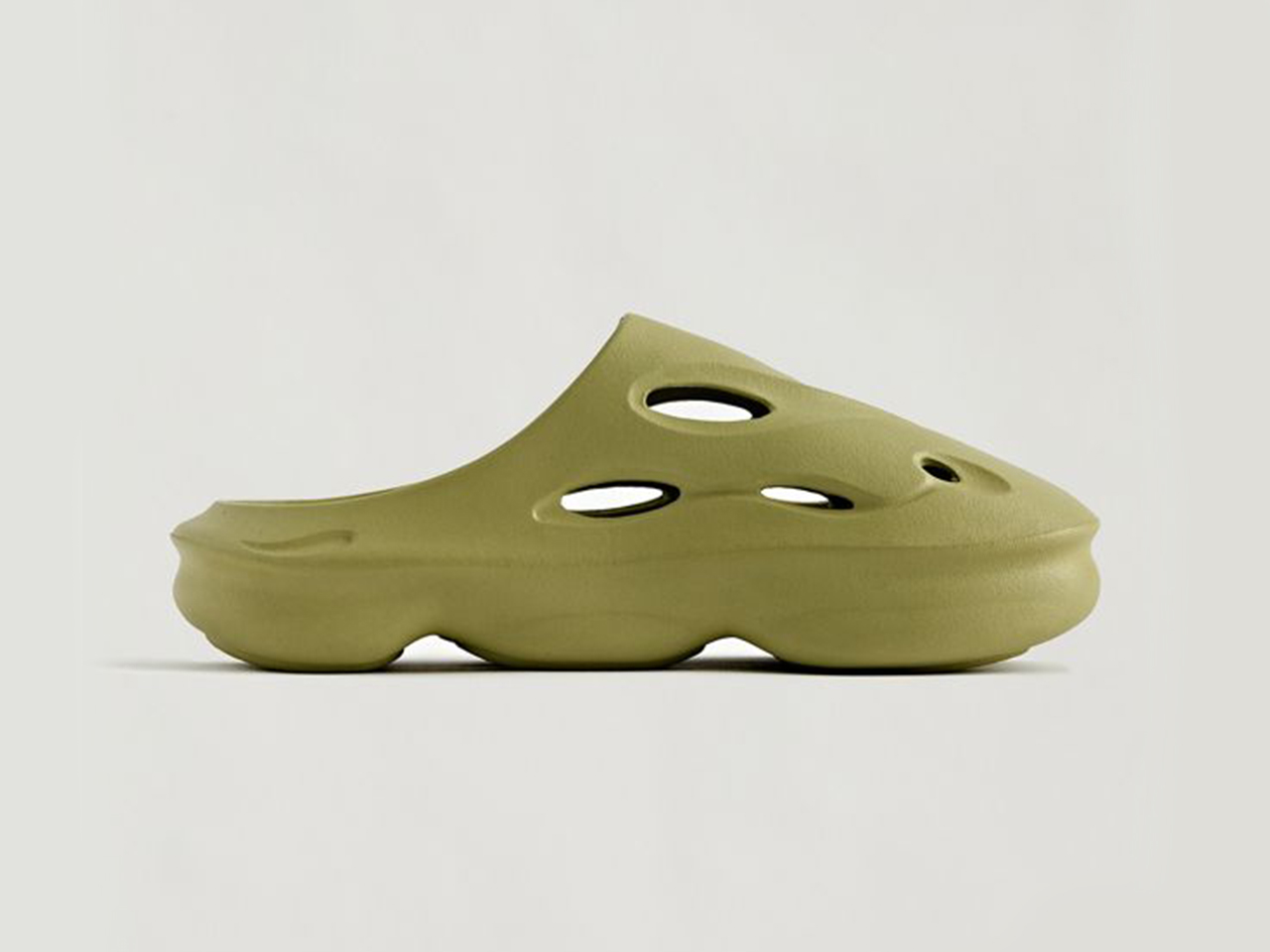 A side profile of a khaki green pair of water clogs from Urban Outfitters.