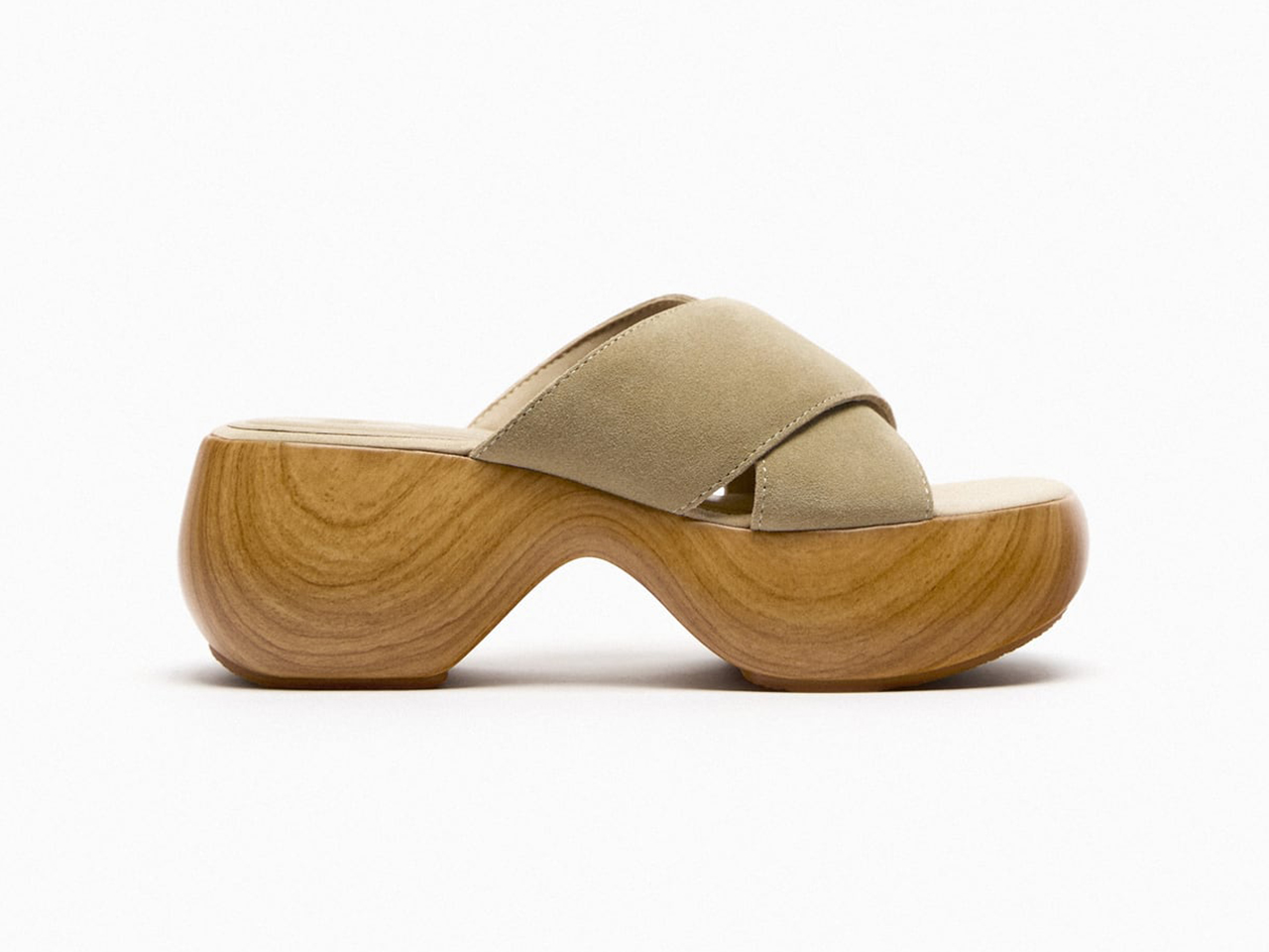 A side profile of a pair of sandals clogs from Zara with a wooden bubble sole.