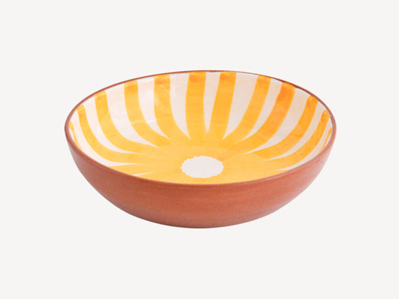A painted and glazed patterned terracotta bowl from Casa Cubista for outdoor entertaining. 
