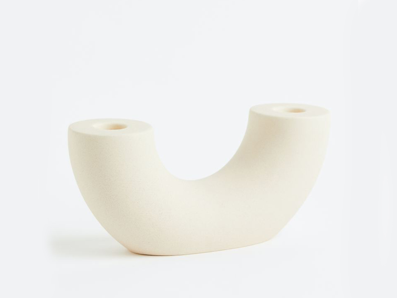 A white ceramic candle holder from H&M for summer outdoor entertaining.