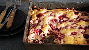 Bushberry pudding cake in a baking pan.