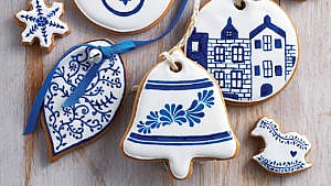 gingerbread cookies decorated with royal icing that can be used as tree ornaments.