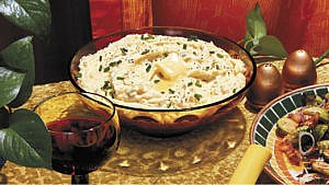 A large bowl of Creamy Mashed Potatoes with Chives and Boursin
