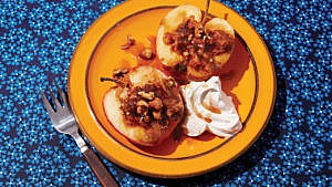 Five-spice roasted apple served with chopped nuts and spiced whipped cream