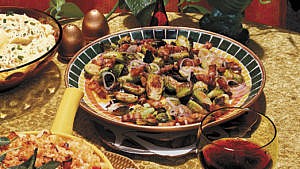 A bowl of Roasted Brussels Sprouts with Pork Belly served as a Thanksgiving side