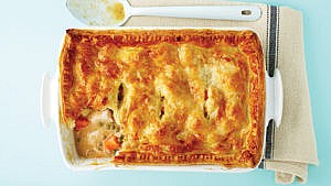 A rectangular casserole dish filled with turkey pot pie made from turkey leftovers