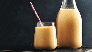 A jug and glass filled with Harvest Spice Smoothie