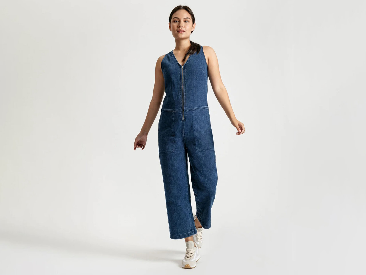 A Duer denim jumpsuit that that is part of the best Black Friday Sales