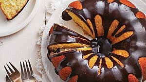 homemade jaffa cake with chocolate glaze on a white plate